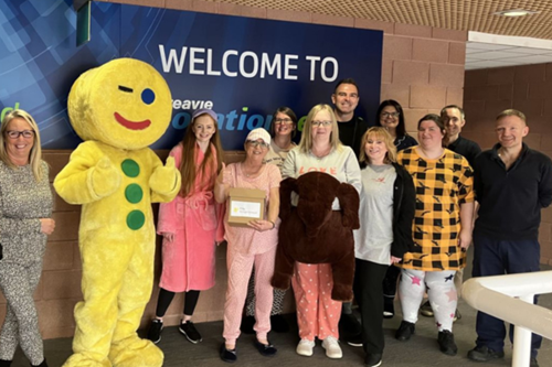 Pitreavie Packaging staff wearing pyjamas to work alongside Fife Gingerbread mascot