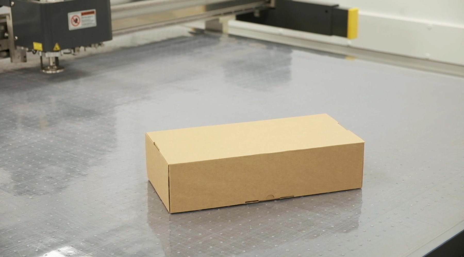 CAD table with cardboard box sample on top